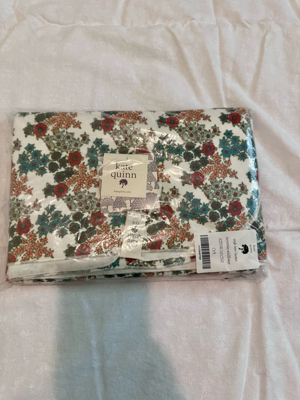 kate quinn Floral Baby Swaddle Blanket in White with Teal & Red Blooms